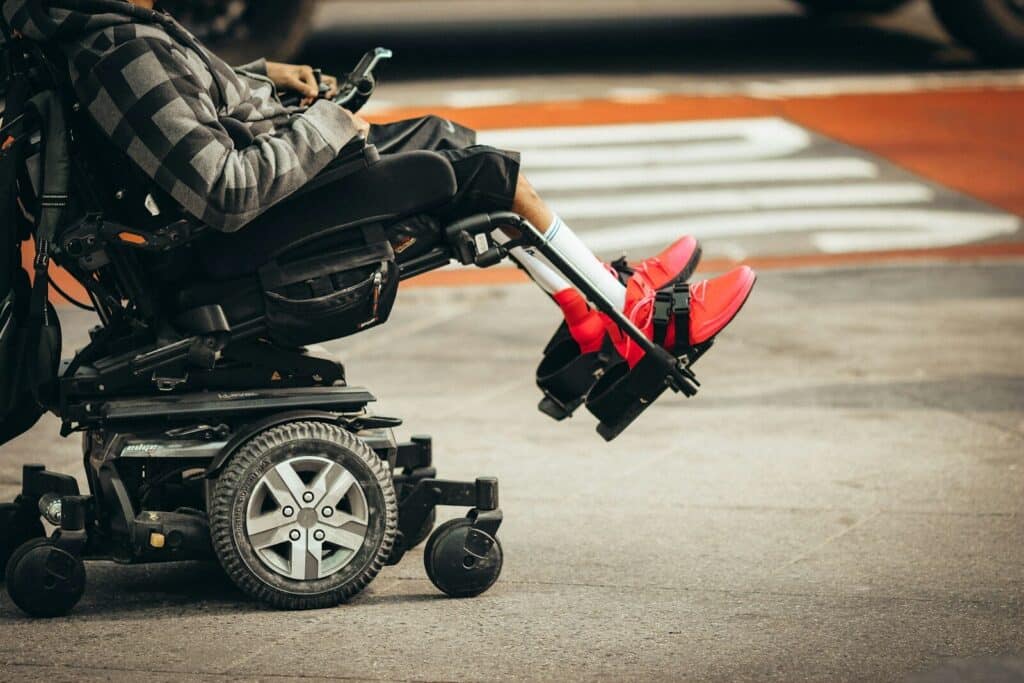 Current image: man in brown jacket and black pants riding black and red motorcycle