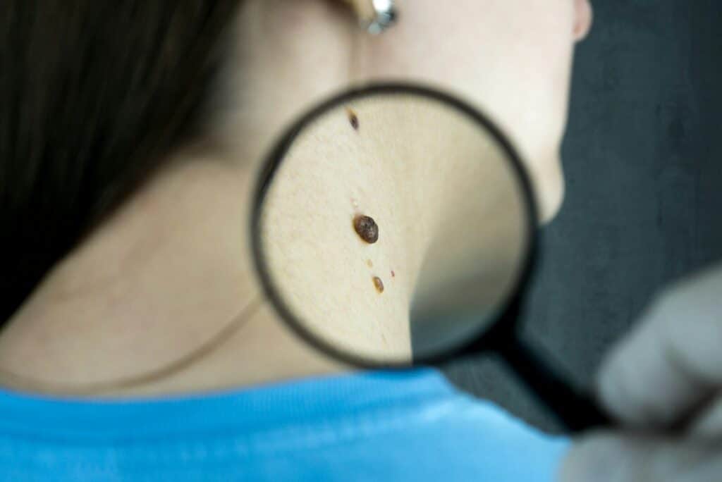 Current image: a close up of a person looking through a magnifying glass
